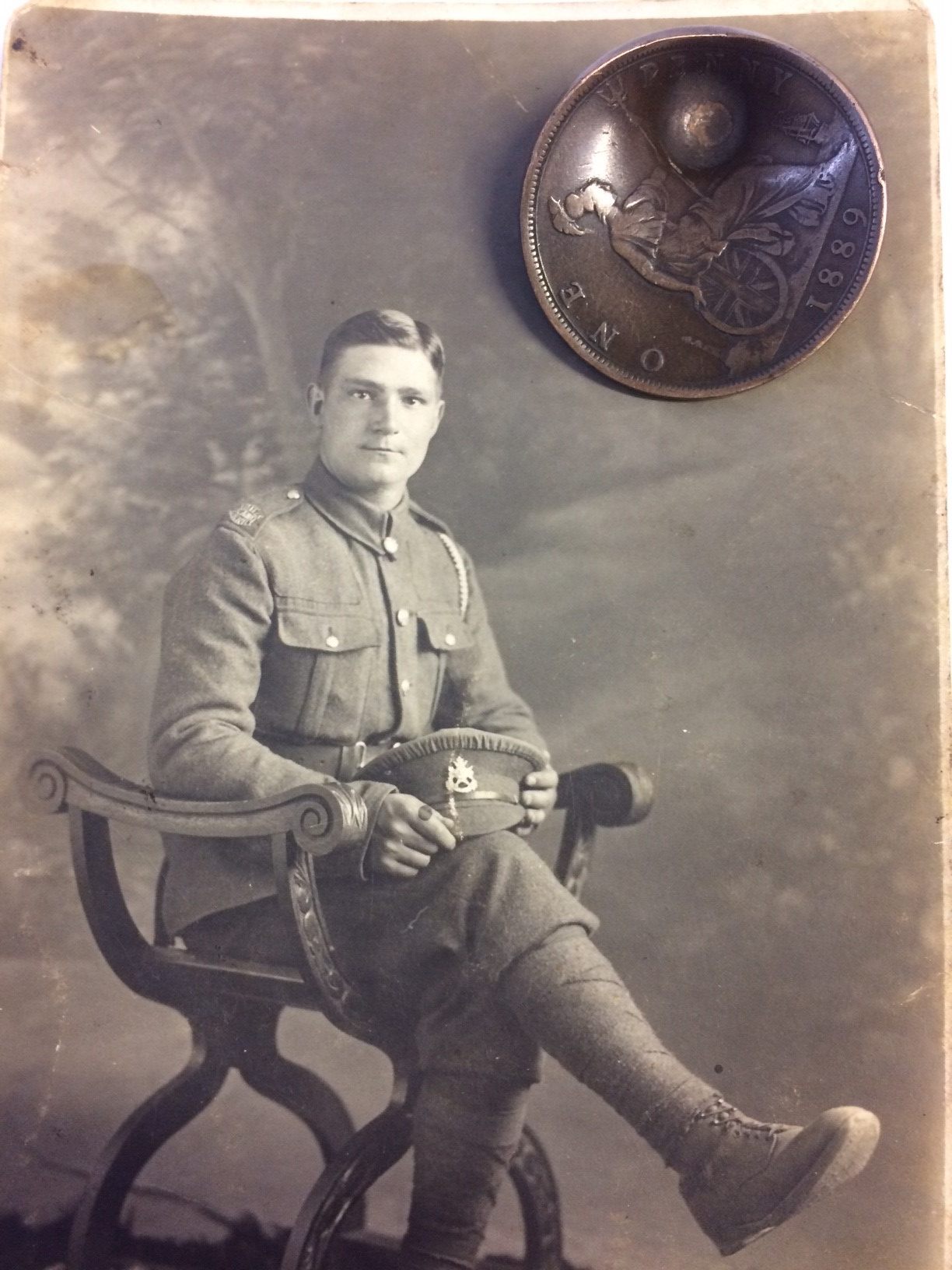 Private John Trickett, pictured with the penny.