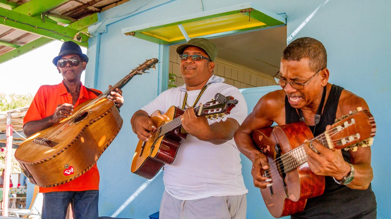 Music is central to Bonairian culture. Here, Calixto Coffie, Nacho Alberto, and Frank Evertsz perform.