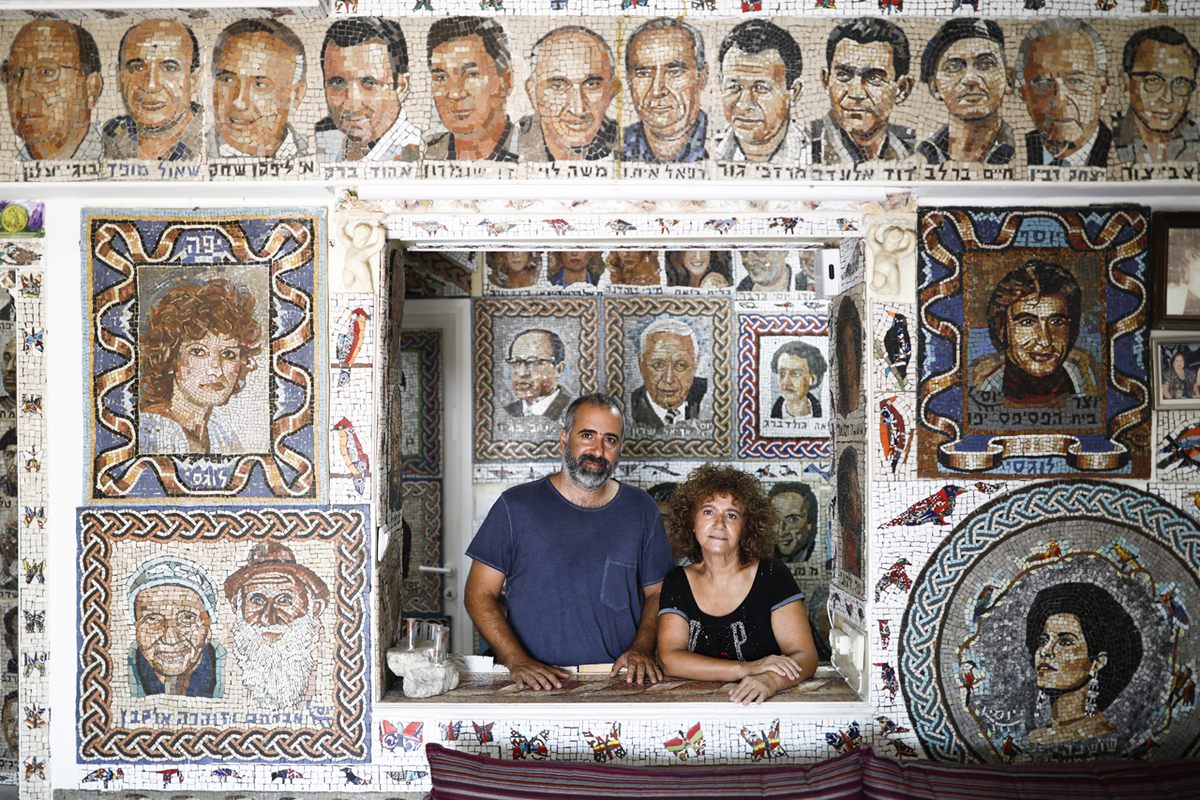 Avi and Yaffa Lugasi surrounded by Yossi's mosaics.