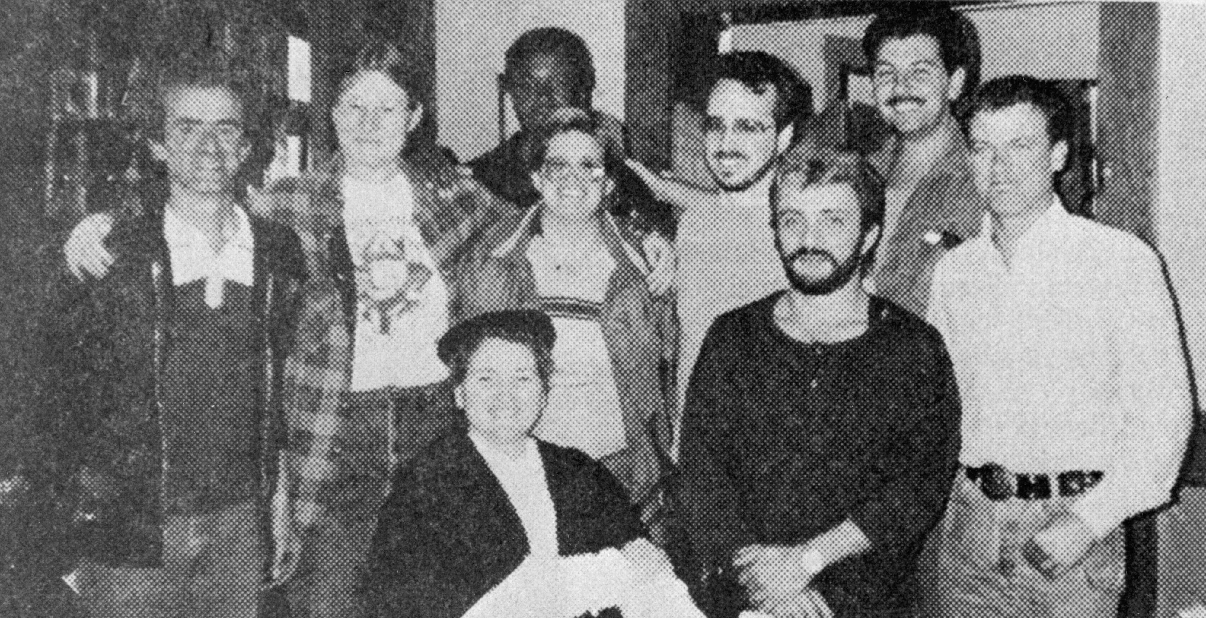 A photo from the <em>Las Vegas Bugle</em> showing the Rhyolite town board members, (back row from left): Fred Schoonmaker, Pamela Dallas, Alfred Parkinson, Terry Scott, Rob Schlegel, Willie Collins; (front row): Renee Lynch, Chuck Melfi and David West.