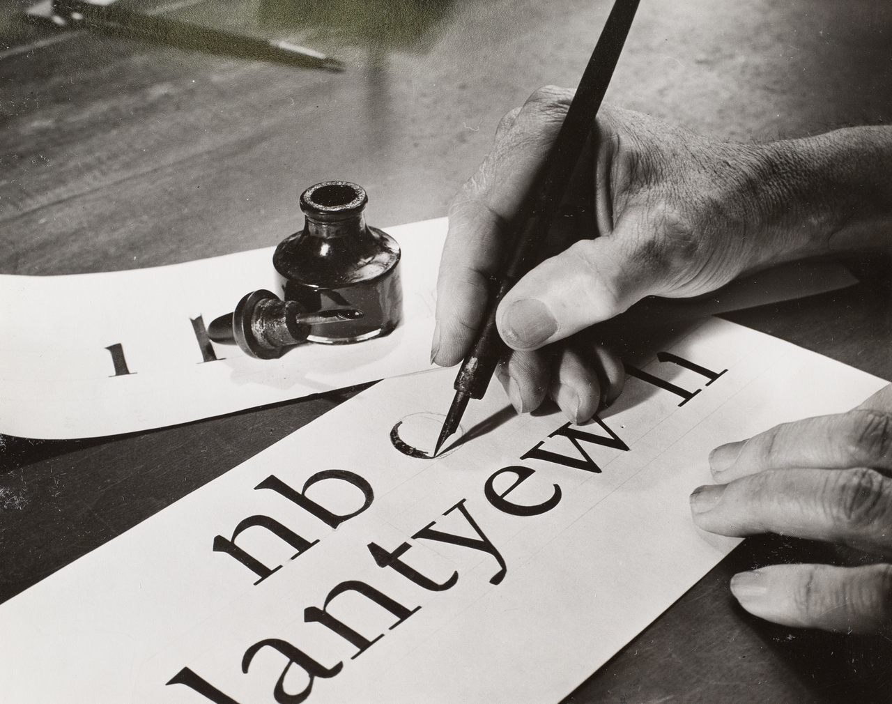 W.A. Dwiggins, hand-drawing letters in 1941.