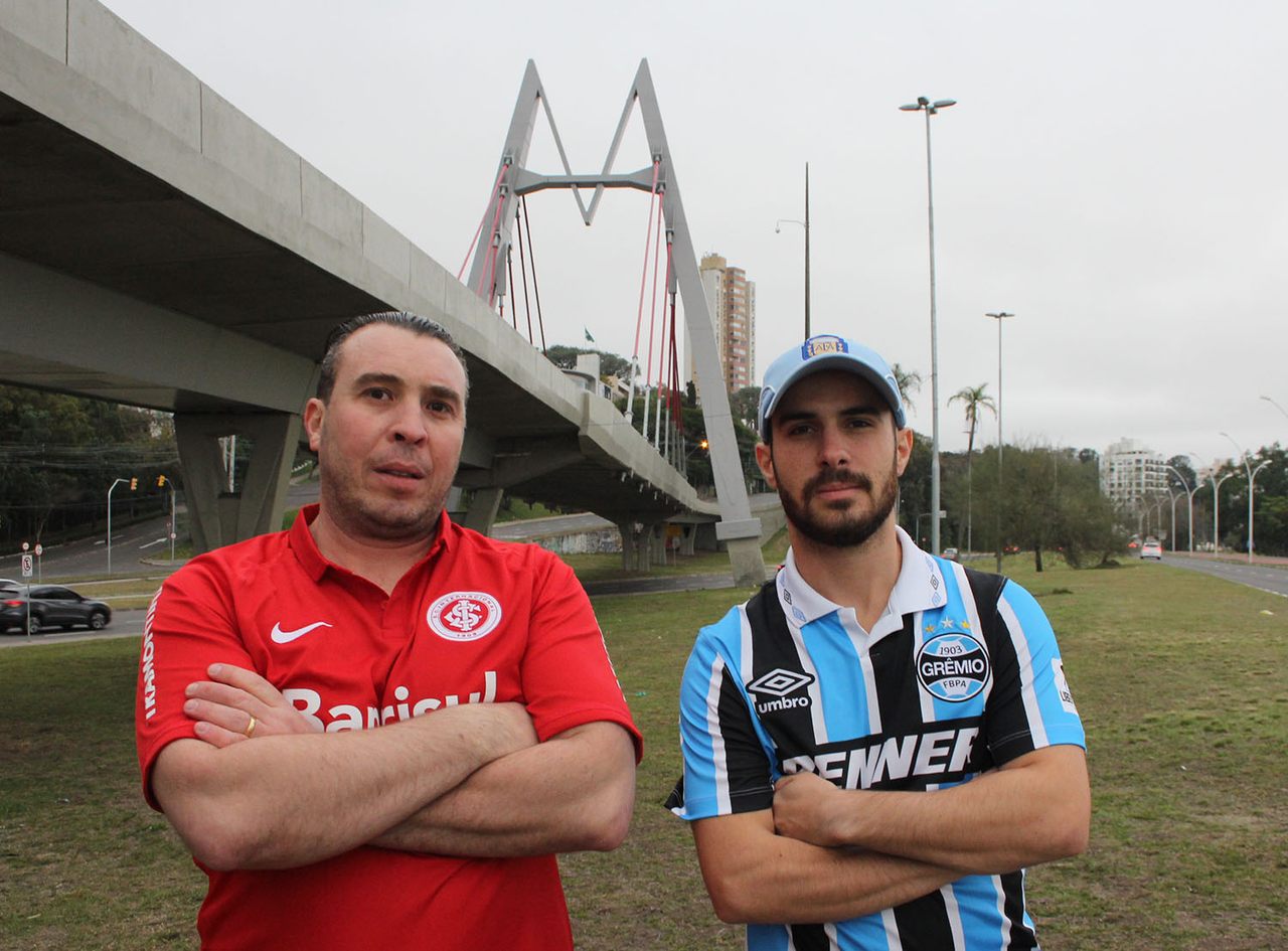 Inter diehard Penny Razzolini (left) and Grêmio diehard Adriano Maffei meet beneath the highway overpass that's become yet another point of contention between the teams' fans.