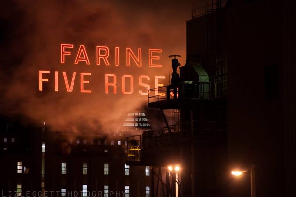 Historical “Farine Five Roses” sign on a cold winter night