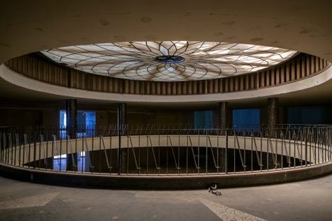 Layers of peeling paint and socialist-era interiors preserved inside the building. https://www.urbex-travel.com/otthon-aruhaz/