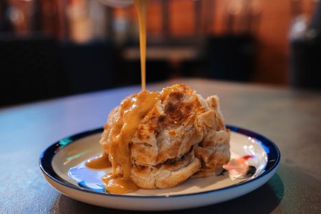 Flaky roti canai comes with a rich curry sauce for dipping or drizzling.