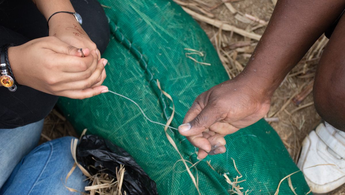 Volunteers stitched and stuffed netting with cane straw, human hair and other material to produce the booms local fishermen deployed around areas affected by the oil spill.