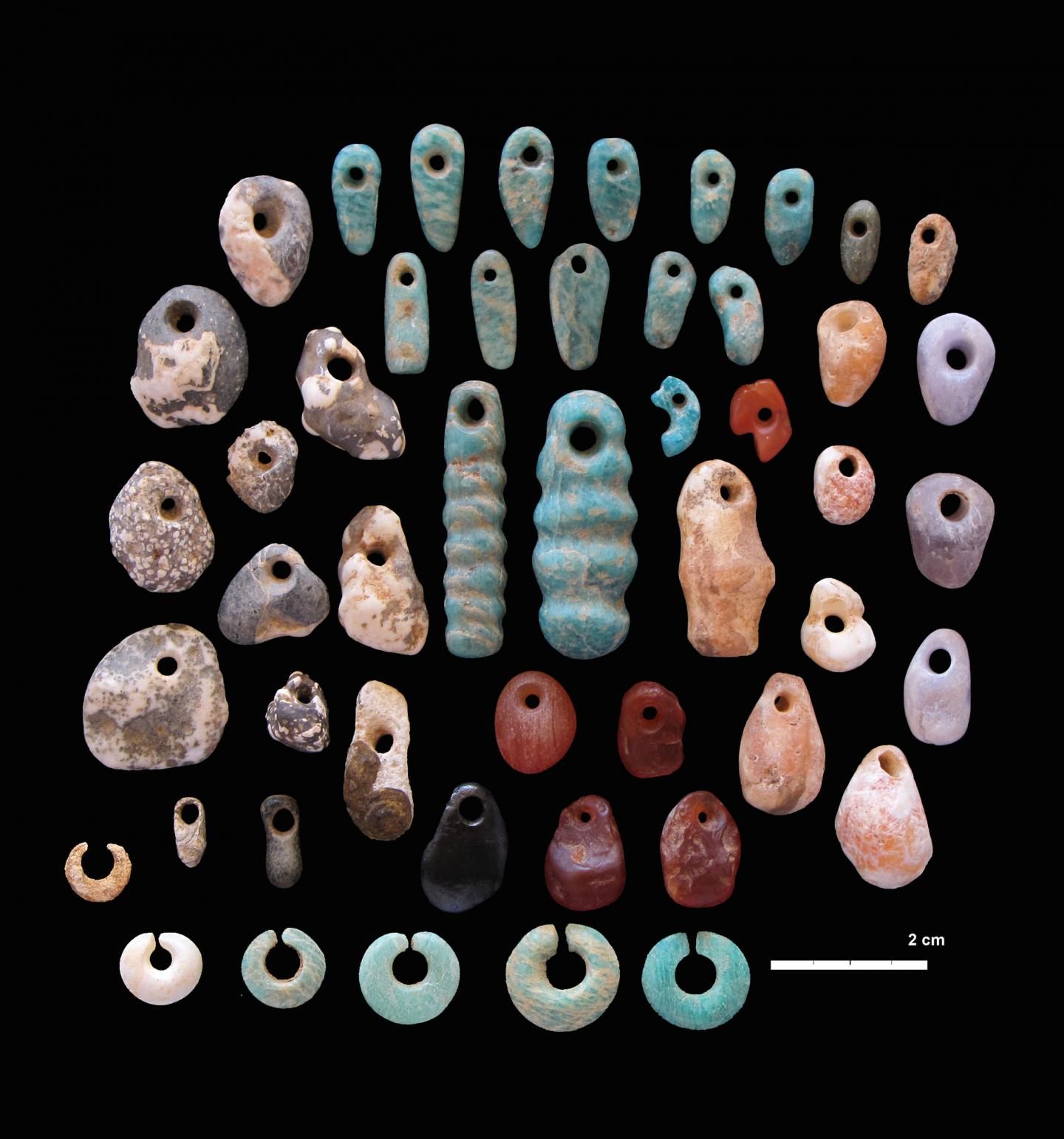 Ground stone beads, found distributed among many different types of people at the site.