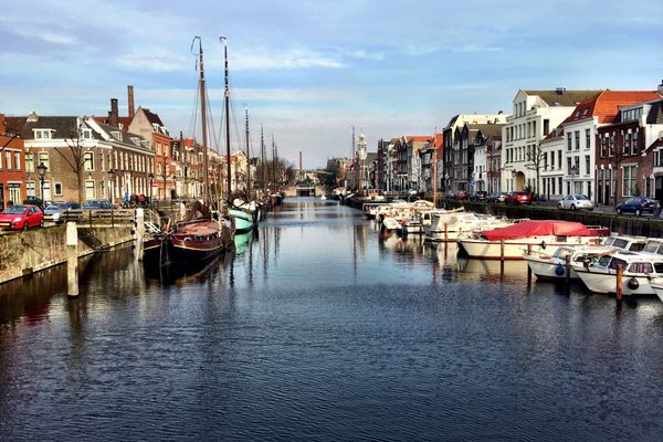 A canal in Rotterdam, showing the Pilgrim Fathers church in the distance.