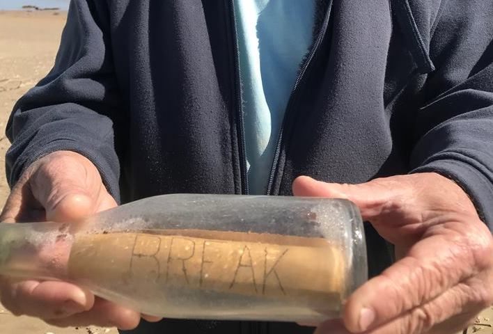 The rolled up message read "BREAK" on one side, and "BOTTLE" on the other.