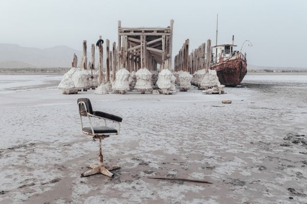 At the port of Sharafkhaneh in 2015, an abandoned ship is stuck in solidified salt.