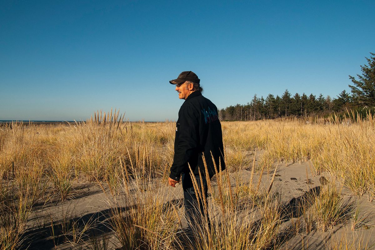 David Cottrell surveys Washaway Beach in November, where his community’s experiments with piles of loose cobble have transformed the shoreline. Whenever he walks here, he grabs fistfuls of seedheads to scatter.