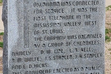 Commemorative stone marking the first commercial telephone line in Indian territory. May 2024