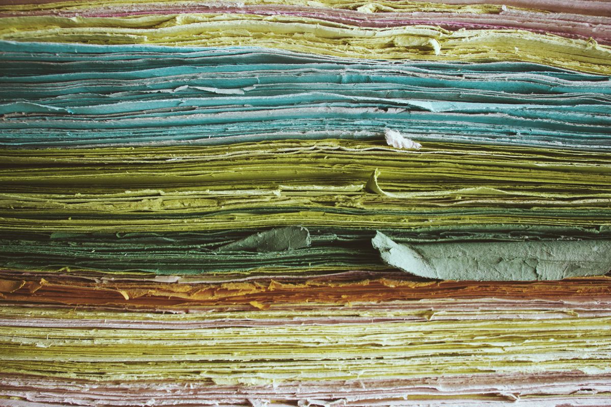 A bundle of paper awaits ironing.