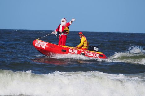 Some years, the water is so choppy, Santa arrives on Mooloolaba  beach in a soaking wet red suit.