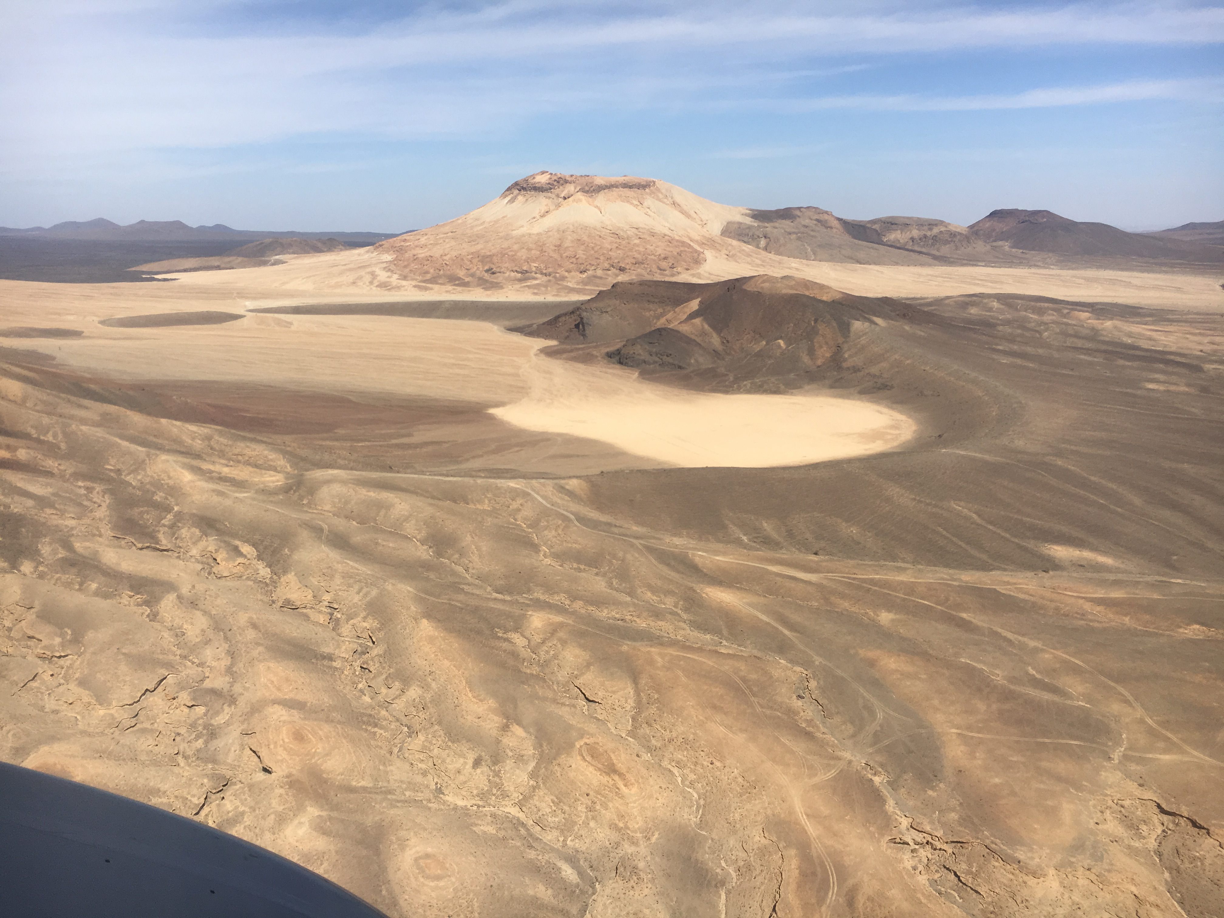 Volcanic landforms being slowly eroded over time through wind and rain.