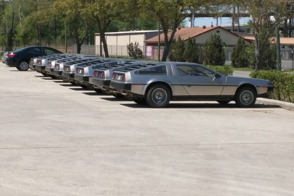 DeLoreans line up outside the repair facility.