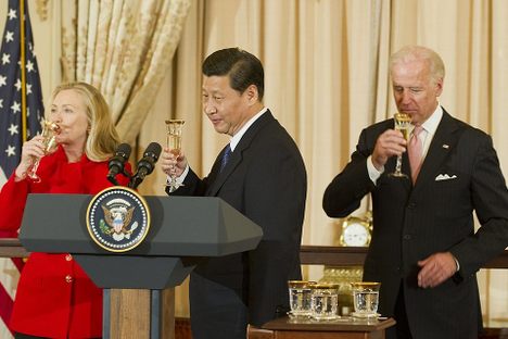 Xi Jinping, Joe Biden, and Hillary Clinton hold a toast at a State Department lunch in February 2012.