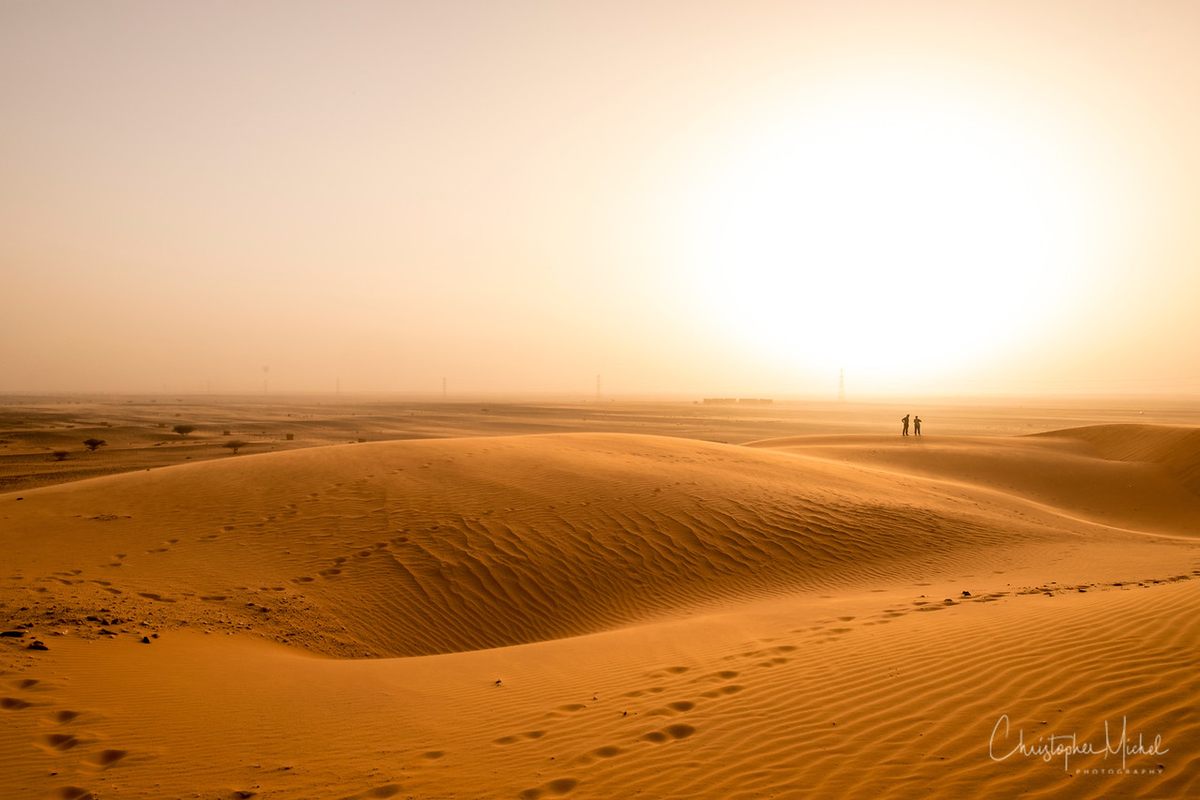 Red sandstorms blend sky and land.