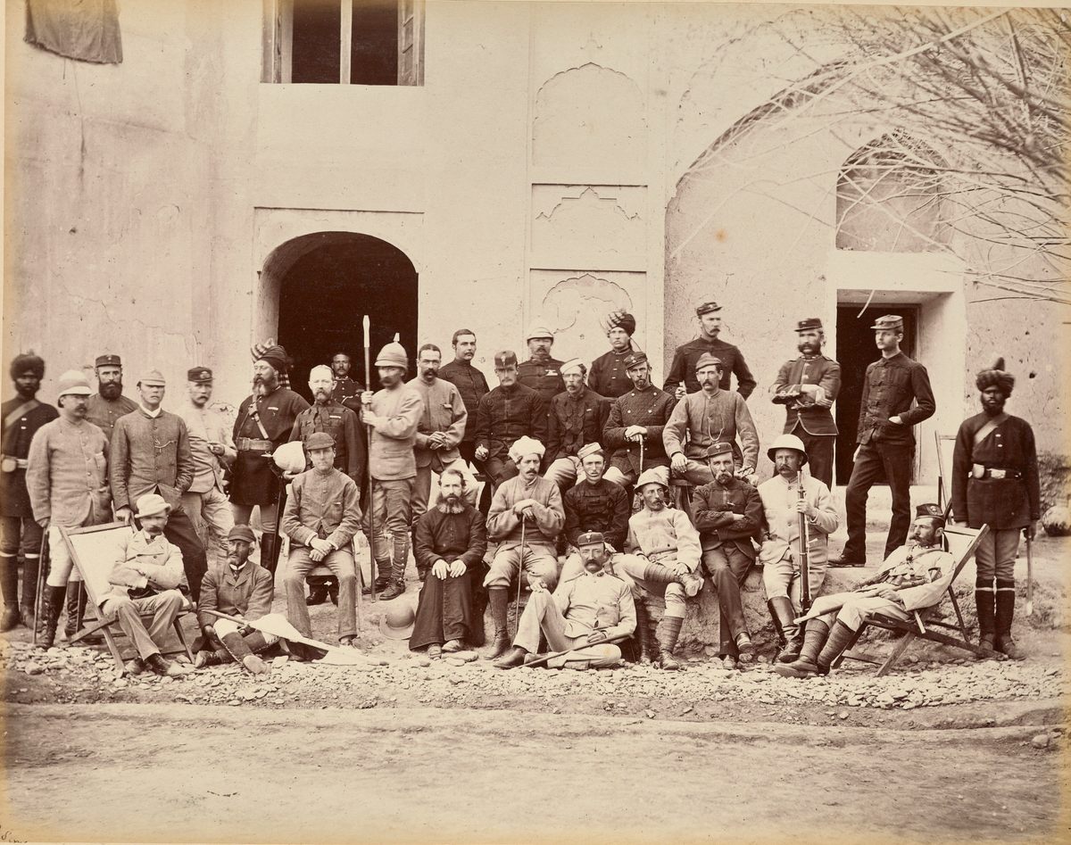 The Qandahar Benjamin Simpson captured with his camera was under siege from Afghan forces trying to reclaim the city. Here, he photographs a group of military officers.