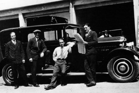 Chauffeurs relaxing next to a Minerva, France. 