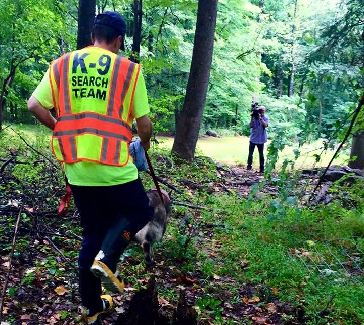 The Pattenburg Volunteer Fire Company and Timmy, their search-and-rescue dog, head out in search of Sulley, while a local cameraman captures the action,