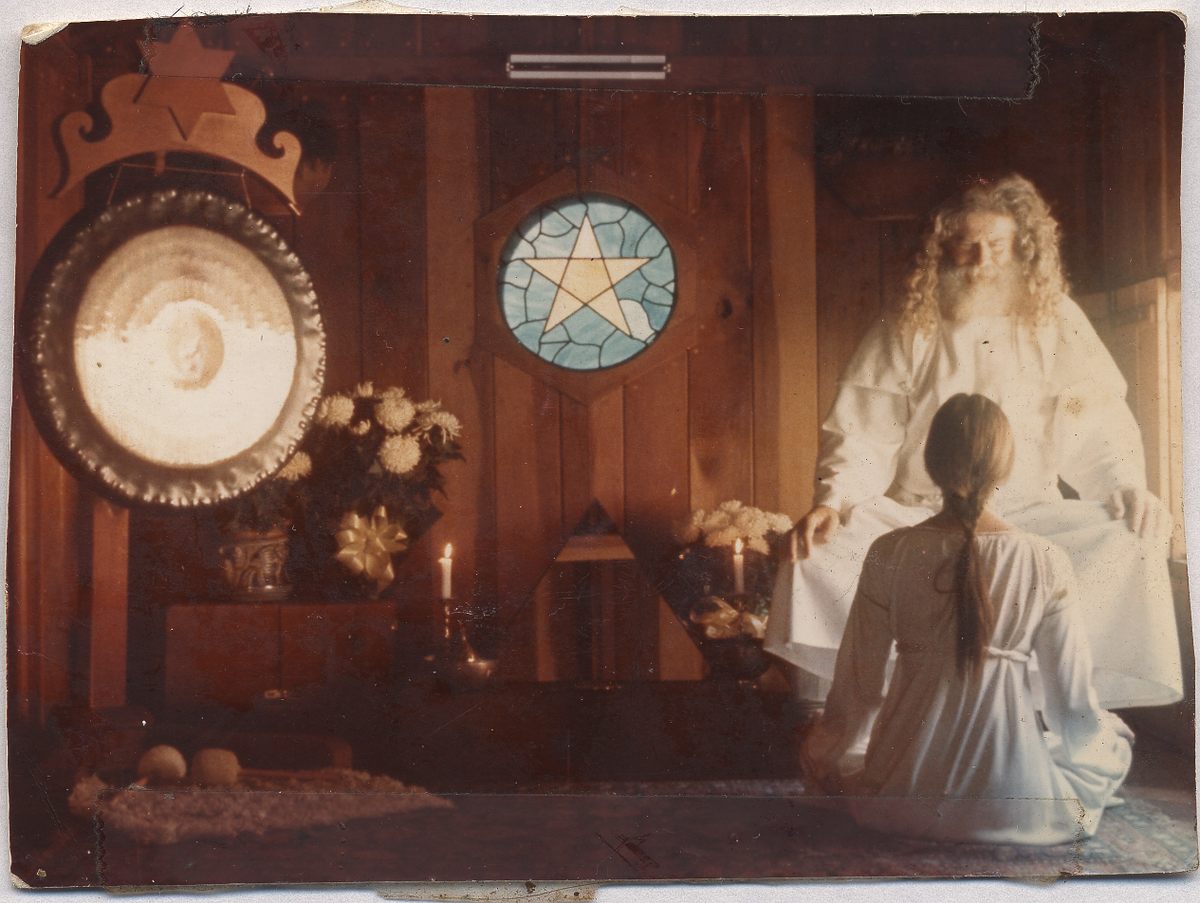 Father Yod, seen here in the Source Family's red wood temple, chose to make Isis Aquarian the family historian.