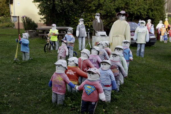 Children of the Doll Garden line up on their way to school. 