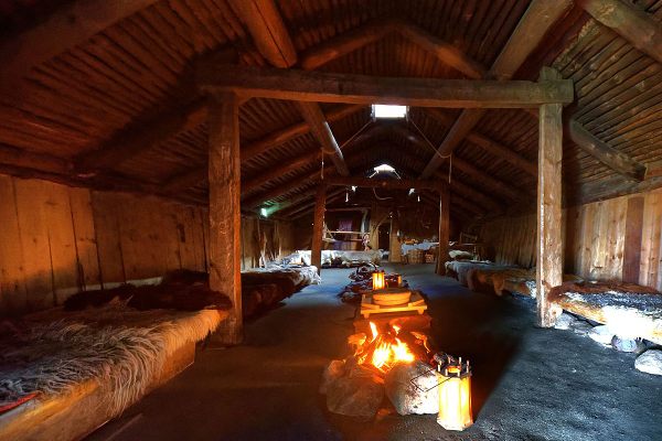 Fire inside the reconstructed longhouse.