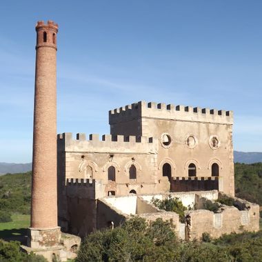 Near the village, there is this curious building, built in 1870. Inside it there was a steam plant, to lift the lead and silver minerals from the galleries below the ground. The miners nicknamed it "Sa Macchina Beccia" (The old machine, in Sardinian language). The plant stopped working in 1940.