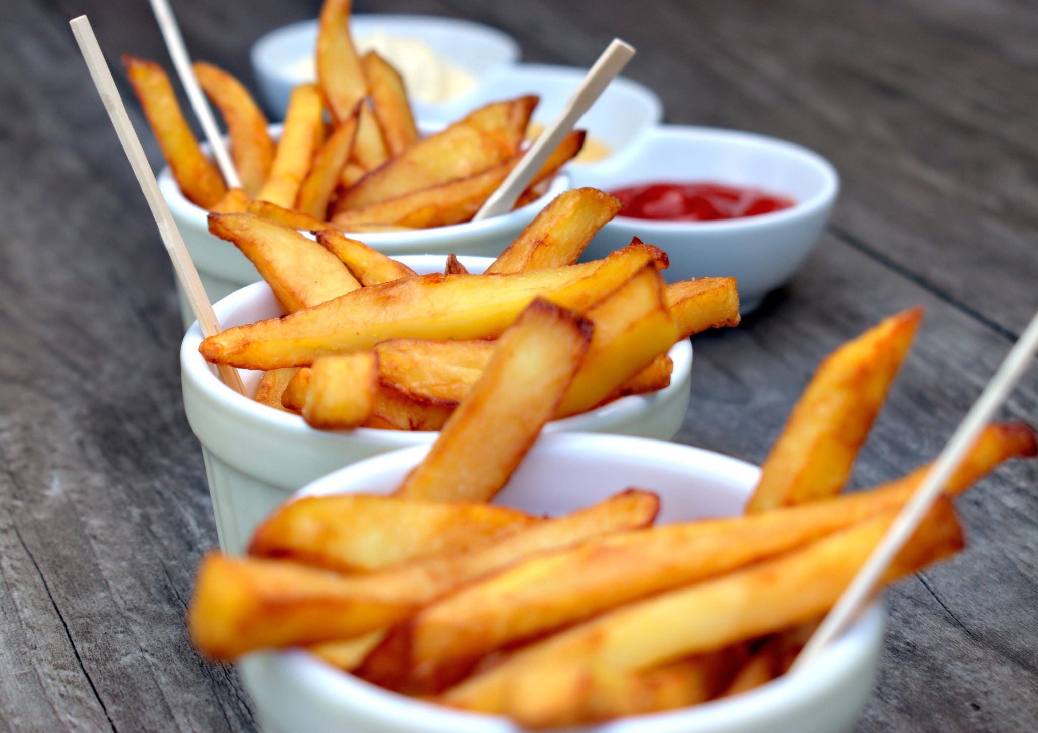 French fries in a bag with ketchup and mayonnaise Stock Photo by