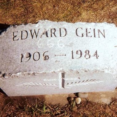 Ed Gein's chipped headstone as it appeared in 1999, prior to being stolen, returned, and sequestered at a museum in Waushara County, Wisconsin.
