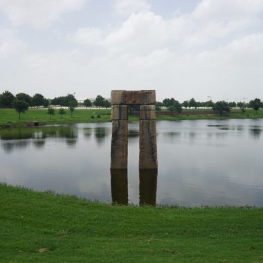 A trilithon of Caelum Moor in a pond