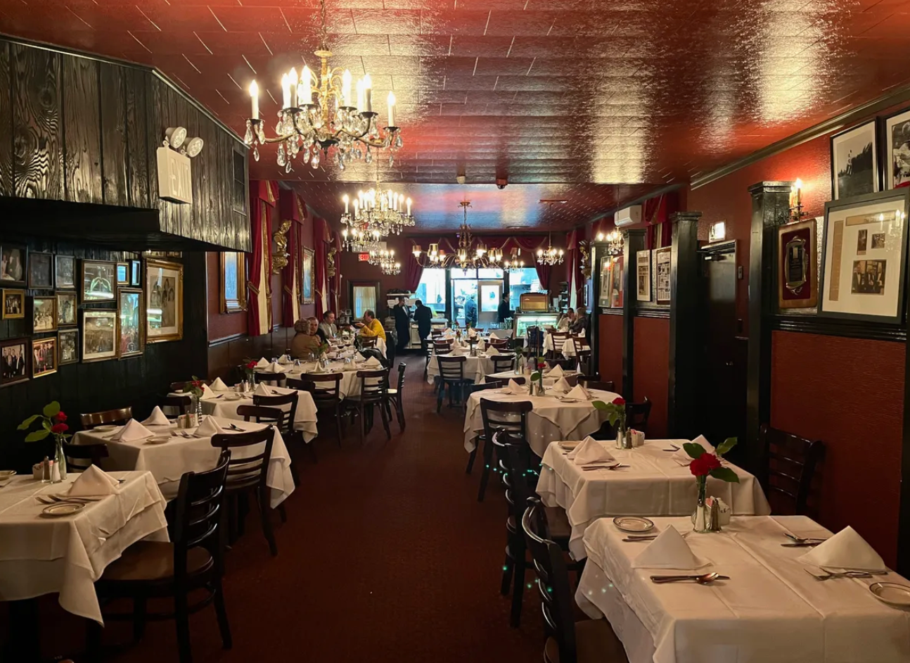Inside, you'll find pressed tin ceilings, old wooden phone booths, and dim lighting.