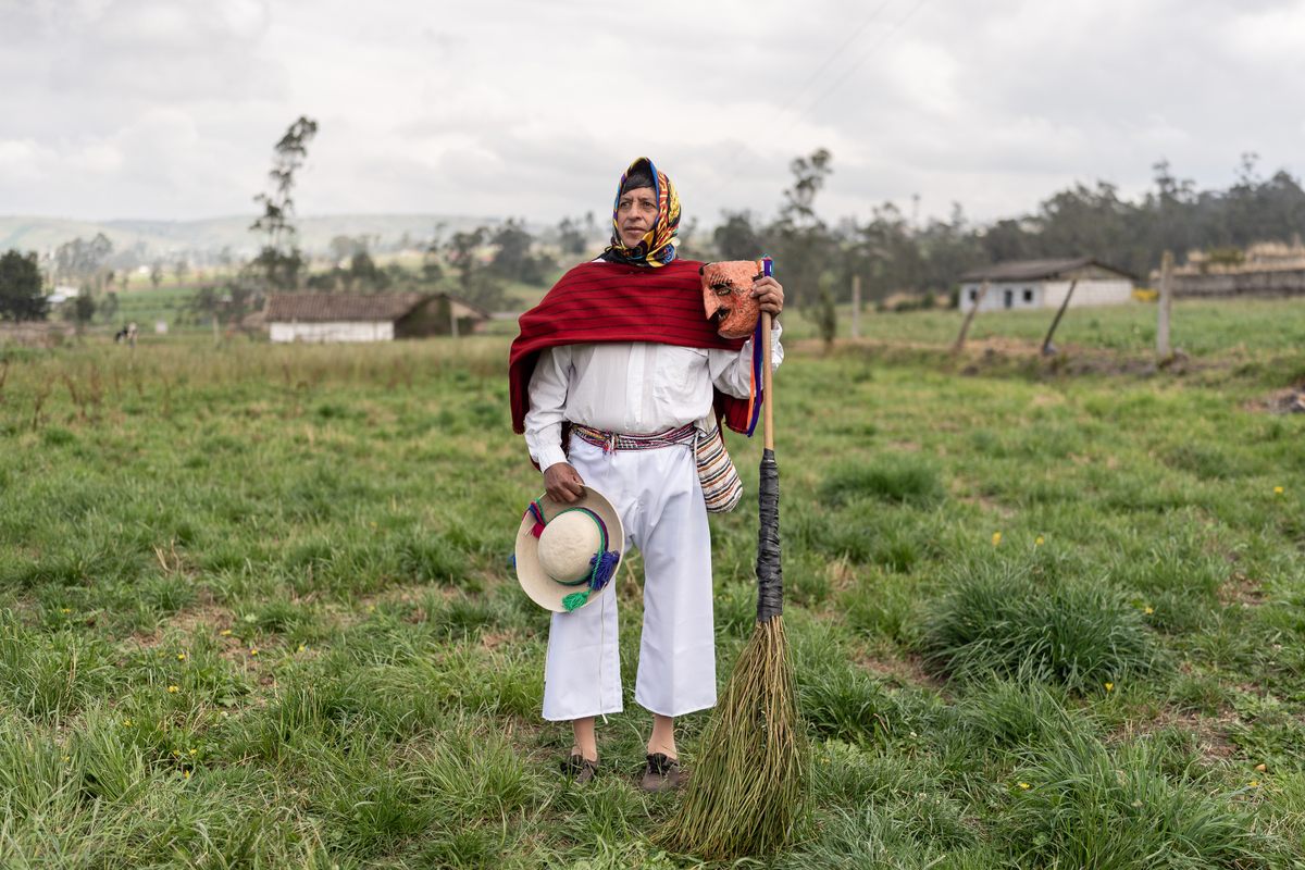 Joselo Calderon, 56, dressed as a <em>capariche</em>, a character that represents the people employed to sweep the streets ahead of the procession.