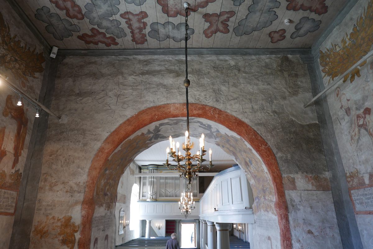 Standing in the chancel and gazing upward at the arched demon wall, visitors see an indistinct, gray haze. The demons are only apparent on closer inspection.