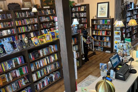 Exposed wooden beams and stained glass lamps give the shop a cozy, old-school feel.