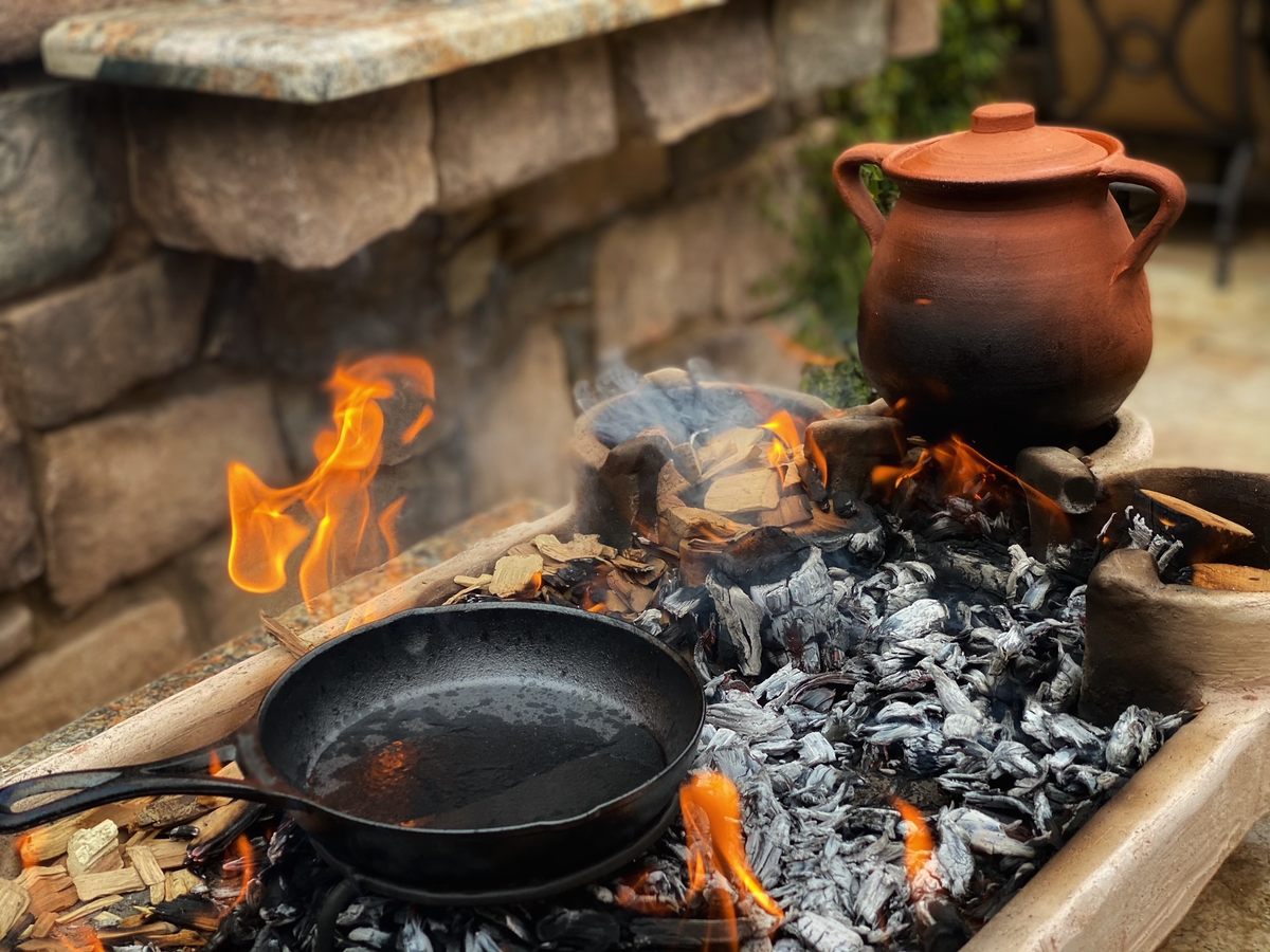 Broth boiling in an olla over a foculus (terracotta brazier).