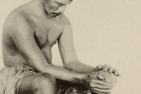 Grating coconuts using a coconut grater school in Tahiti, circa 1911. 