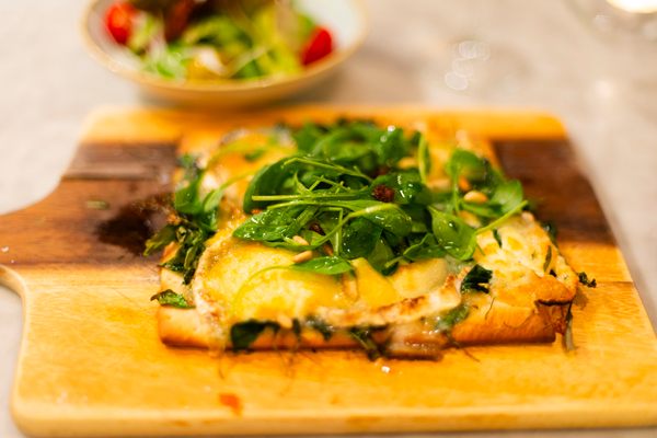 Unlike pizza, this flatbread is seldom topped with cheese or tomato.