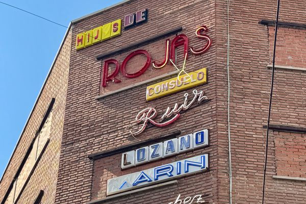 Commercial Signage on the Façade of Gruta 77