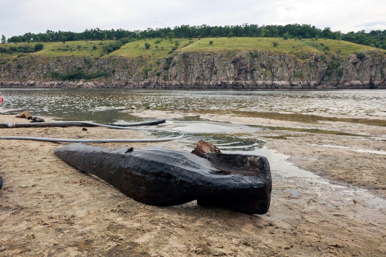 In late June, weeks after the catastrophic destruction of Ukraine's Kakhovka Dam, lowered water levels upriver revealed this ancient boat.