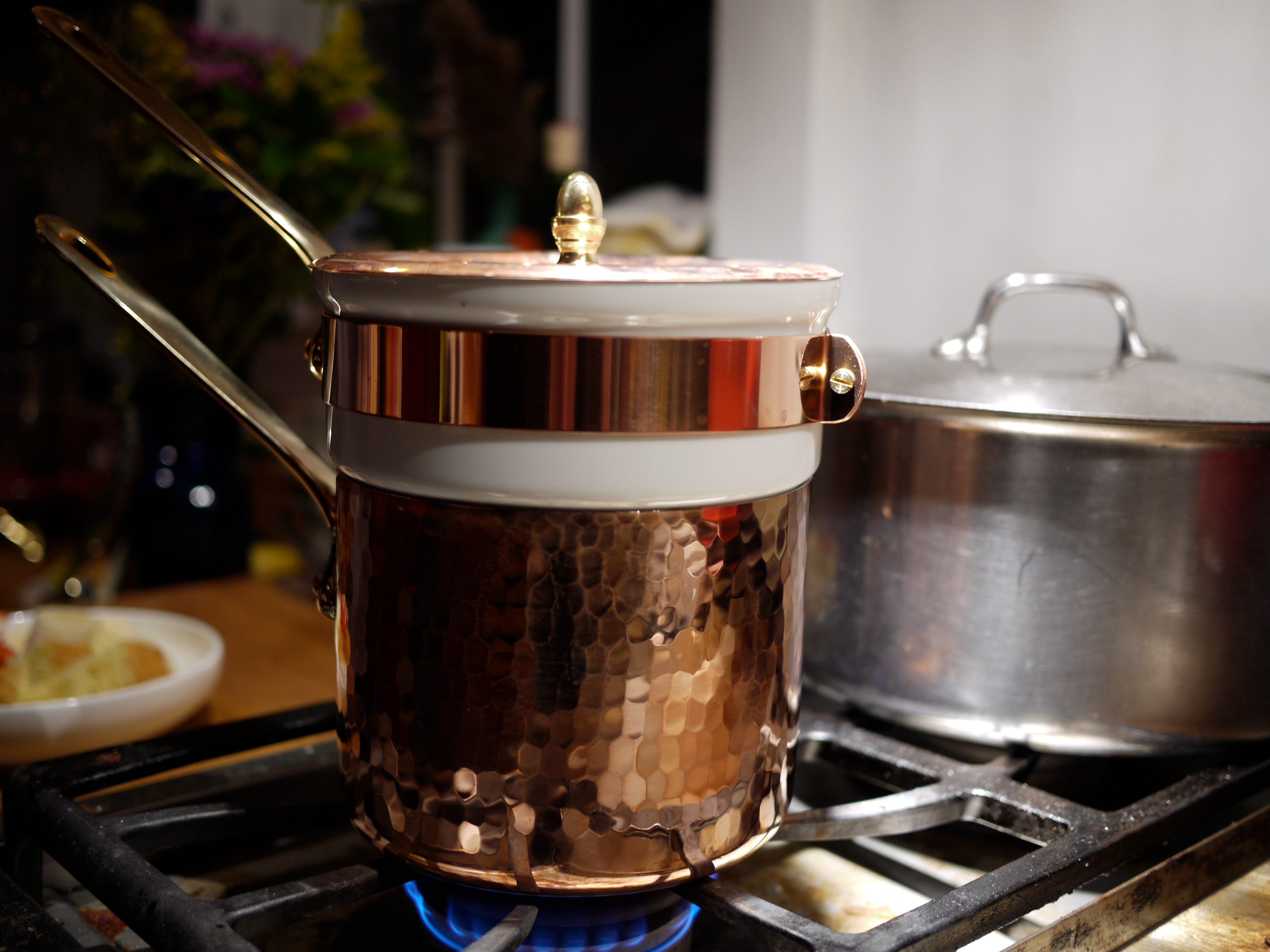 A bowl over a pot of boiling water achieves a similar effect to this commercial bain-Marie.