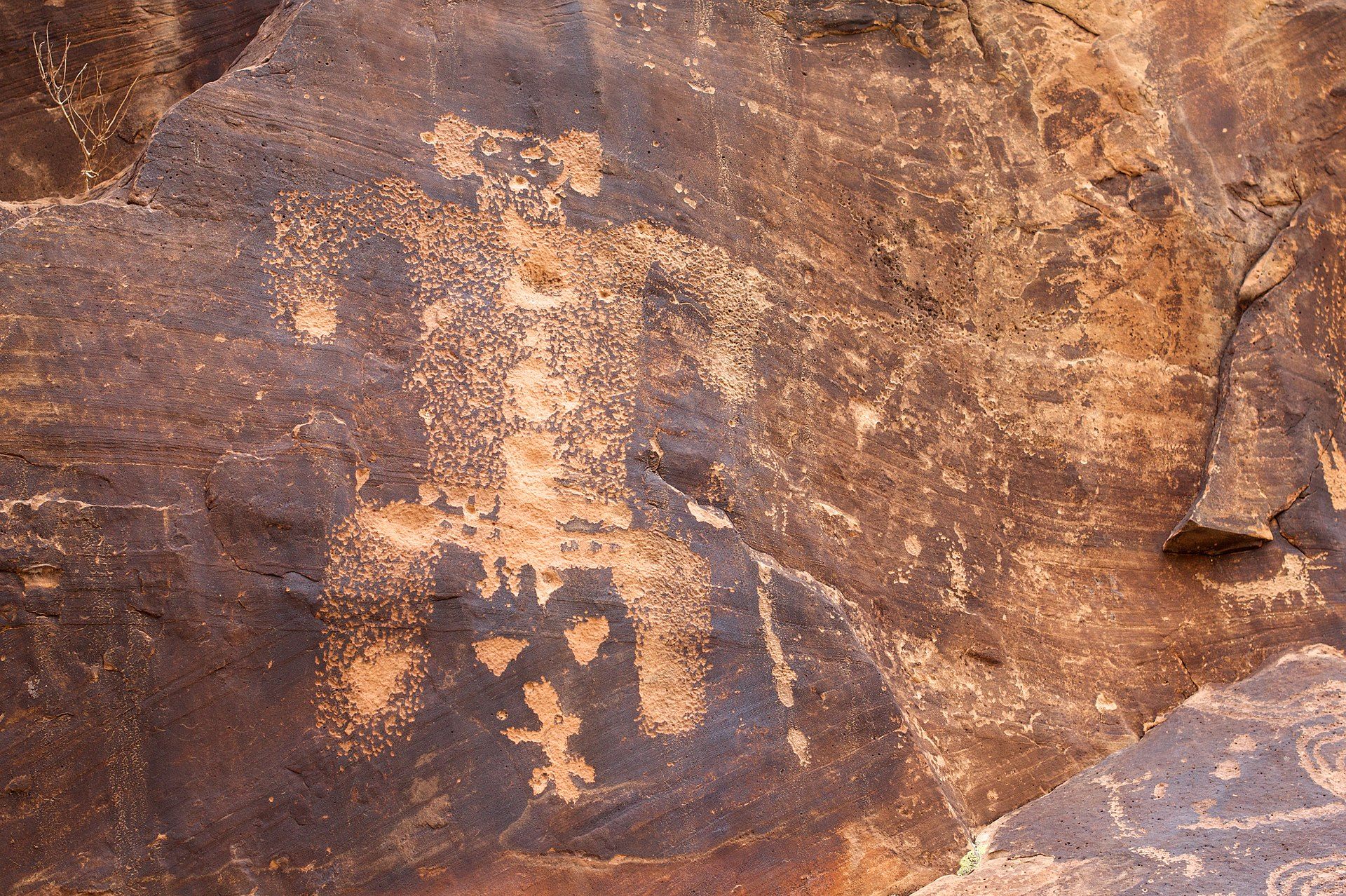 While the meanings of many petroglyphs are up for debate, this one most likely depicts a birthing scene.