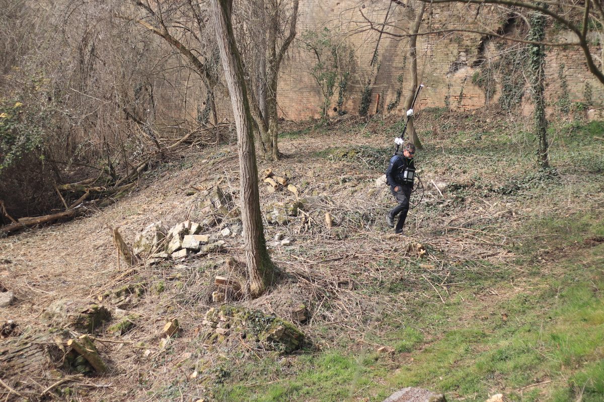 A team from Co.Ve.Smi. searches for ferromagnetic interference among the rubble of the Forte di Pietole, a Napoleonic fort.
