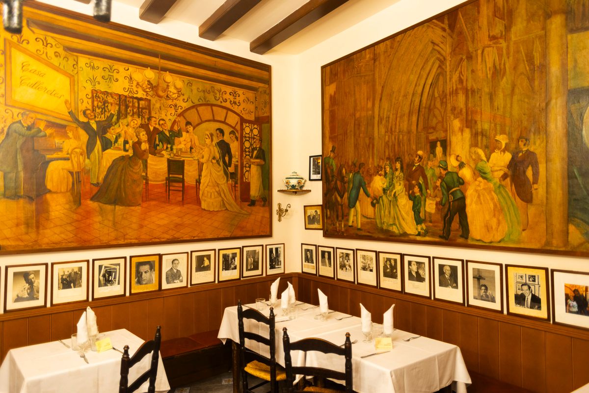 Can Culleretes, the oldest restaurant in Barcelona, boasts fading murals and colorful Portuguese tiles on its walls.