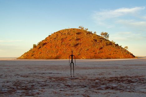 One of the "islands" in Lake Ballard as a backdrop to one of the figures