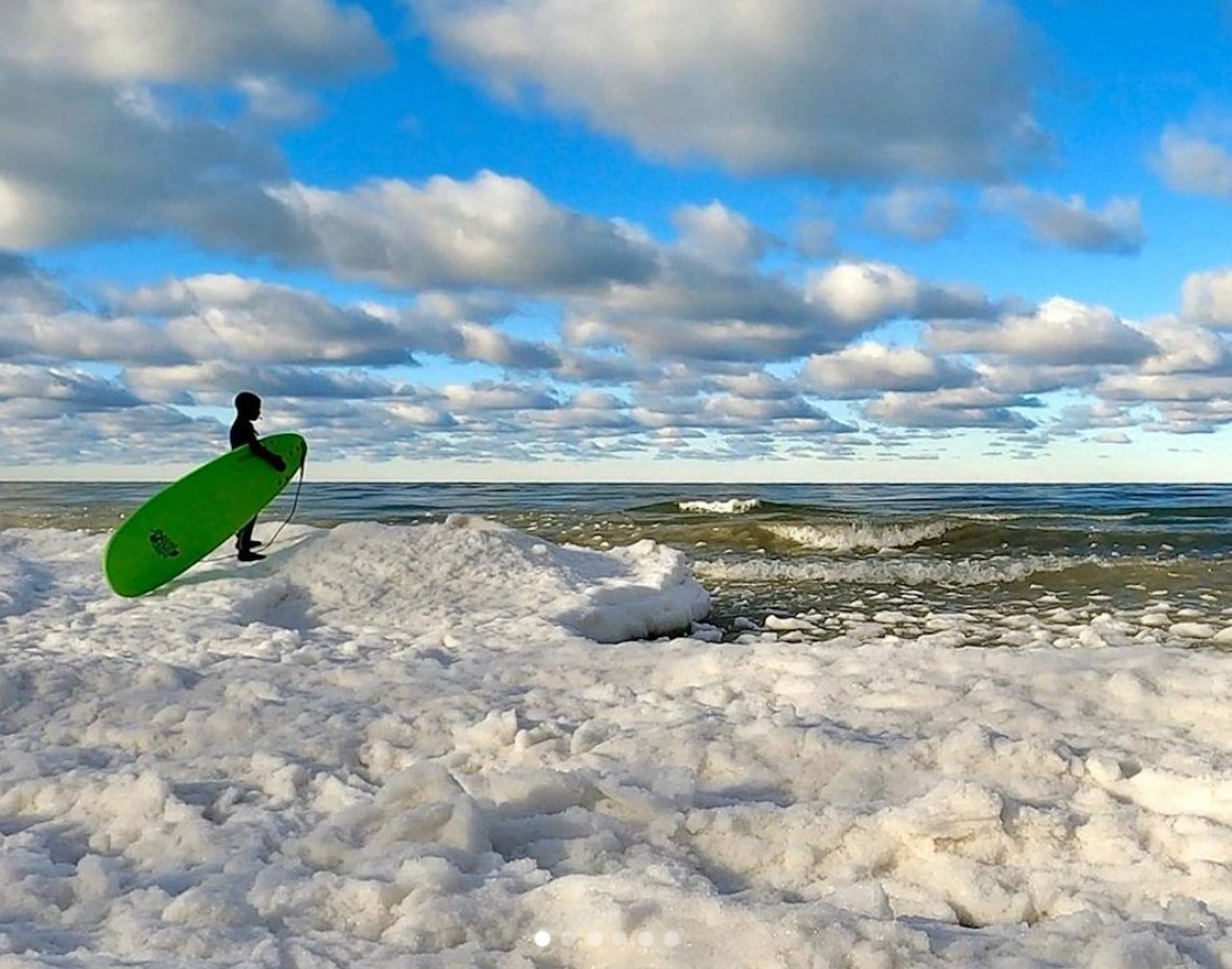 Eleven-year-old Jameson Walter contemplates a winter surf session on Lake Michigan, where he has been catching waves since the age of six.