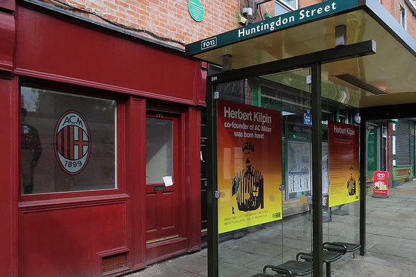 Renovated shop front, with the A.C. Milan logo.