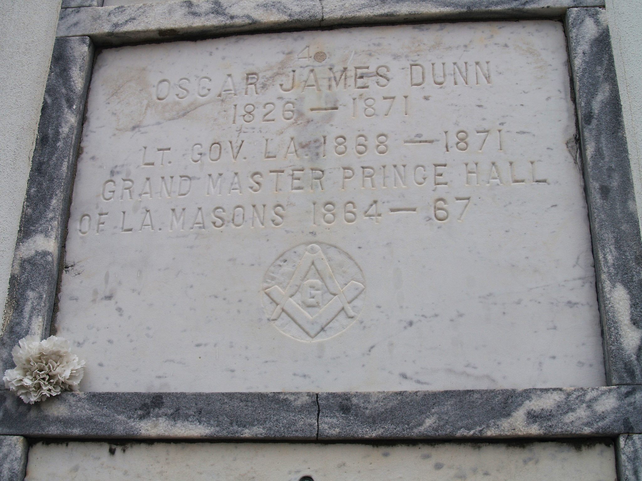The plaque at Oscar Dunn's tomb in St. Louis Cemetery.