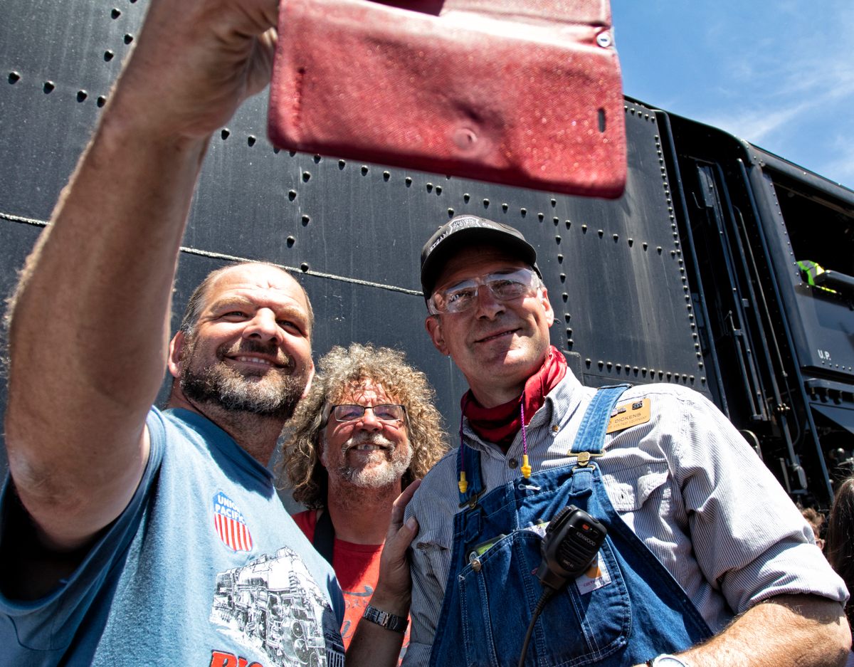 Ed Dickens (right) knows how to draw a crowd. Bring a giant steam locomotive.